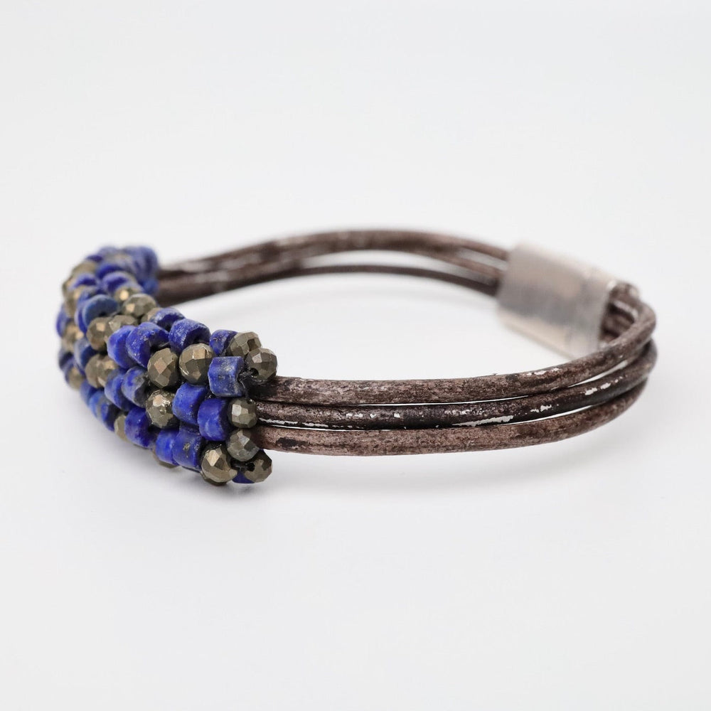 
                  
                    BRC-JM Hand Stitched Afghan Lapis & Pyrite Leather Bracelet
                  
                