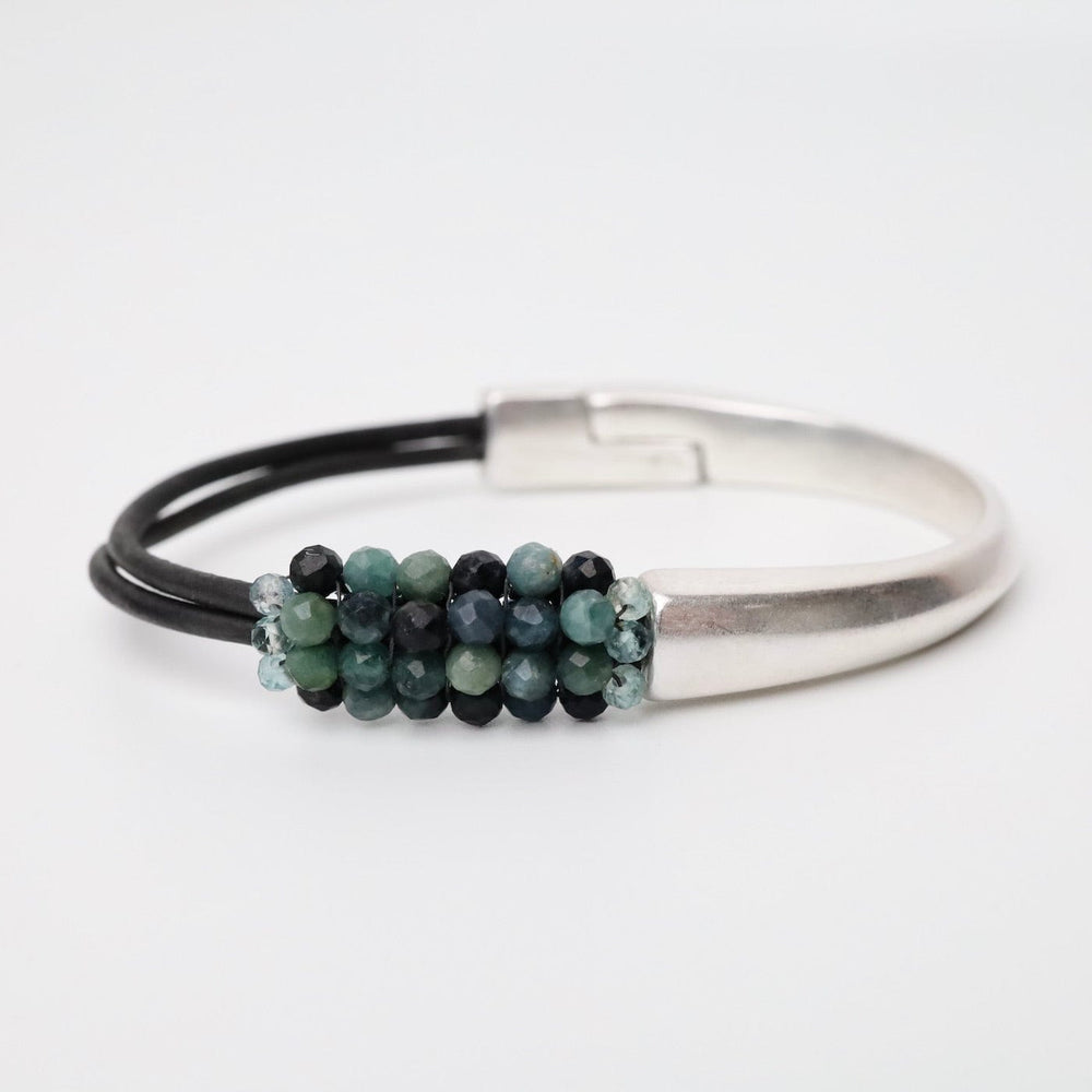 
                      
                        BRC-JM Hand Stitched Blue Tourmaline Half Cuff Bracelet
                      
                    