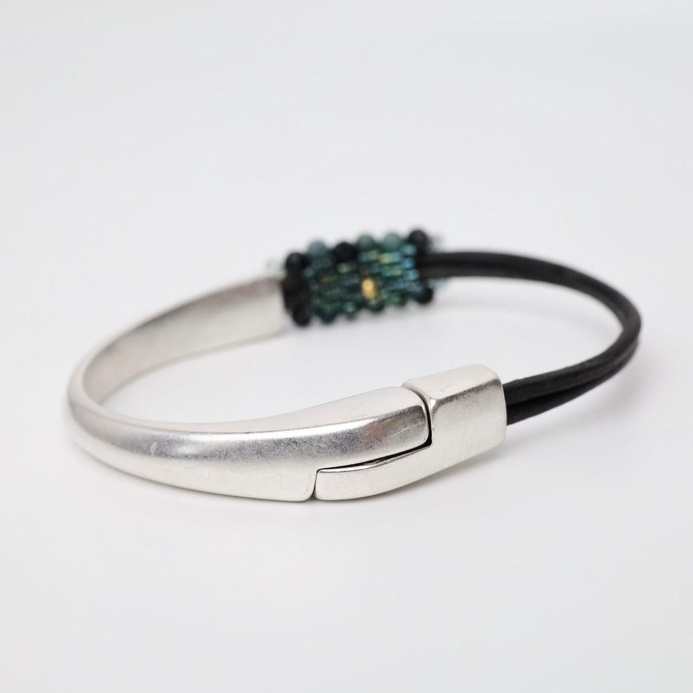 
                      
                        BRC-JM Hand Stitched Blue Tourmaline Half Cuff Bracelet
                      
                    