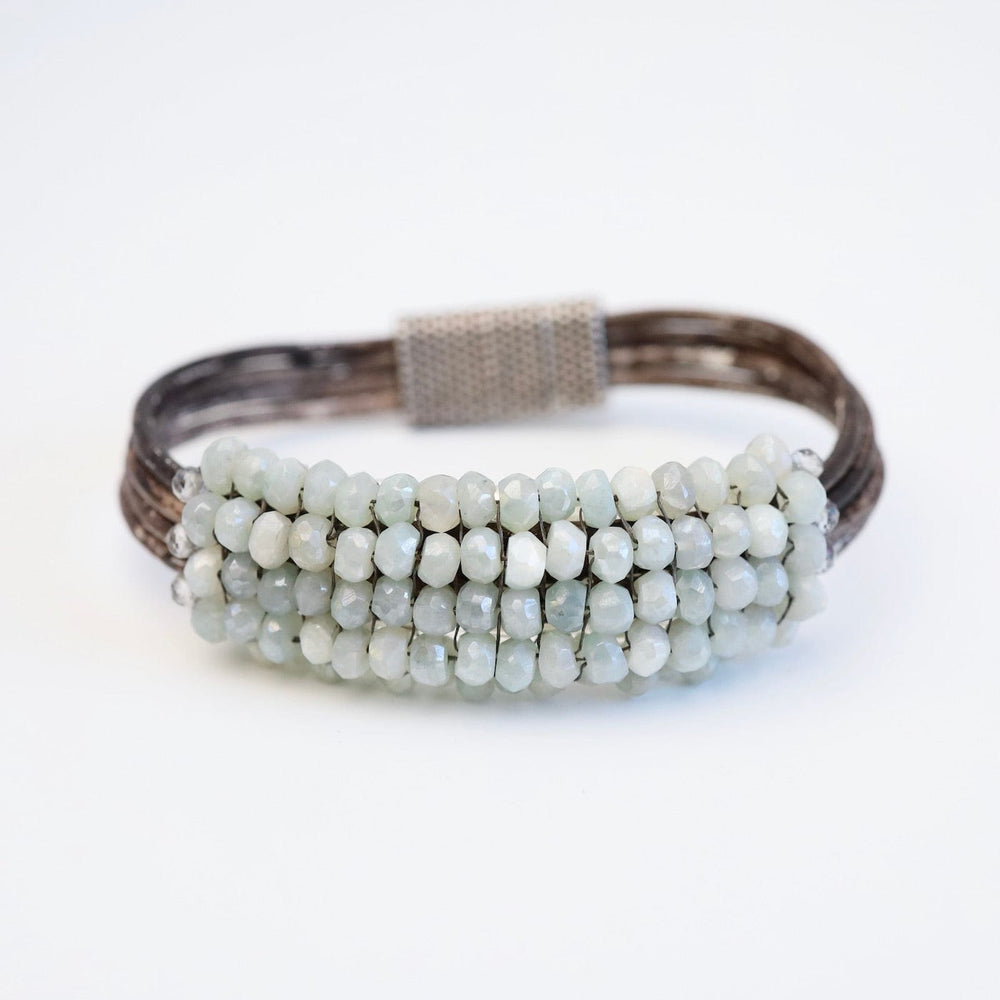 
                  
                    BRC-JM Hand Stitched Coated Aquamarine Bracelet
                  
                