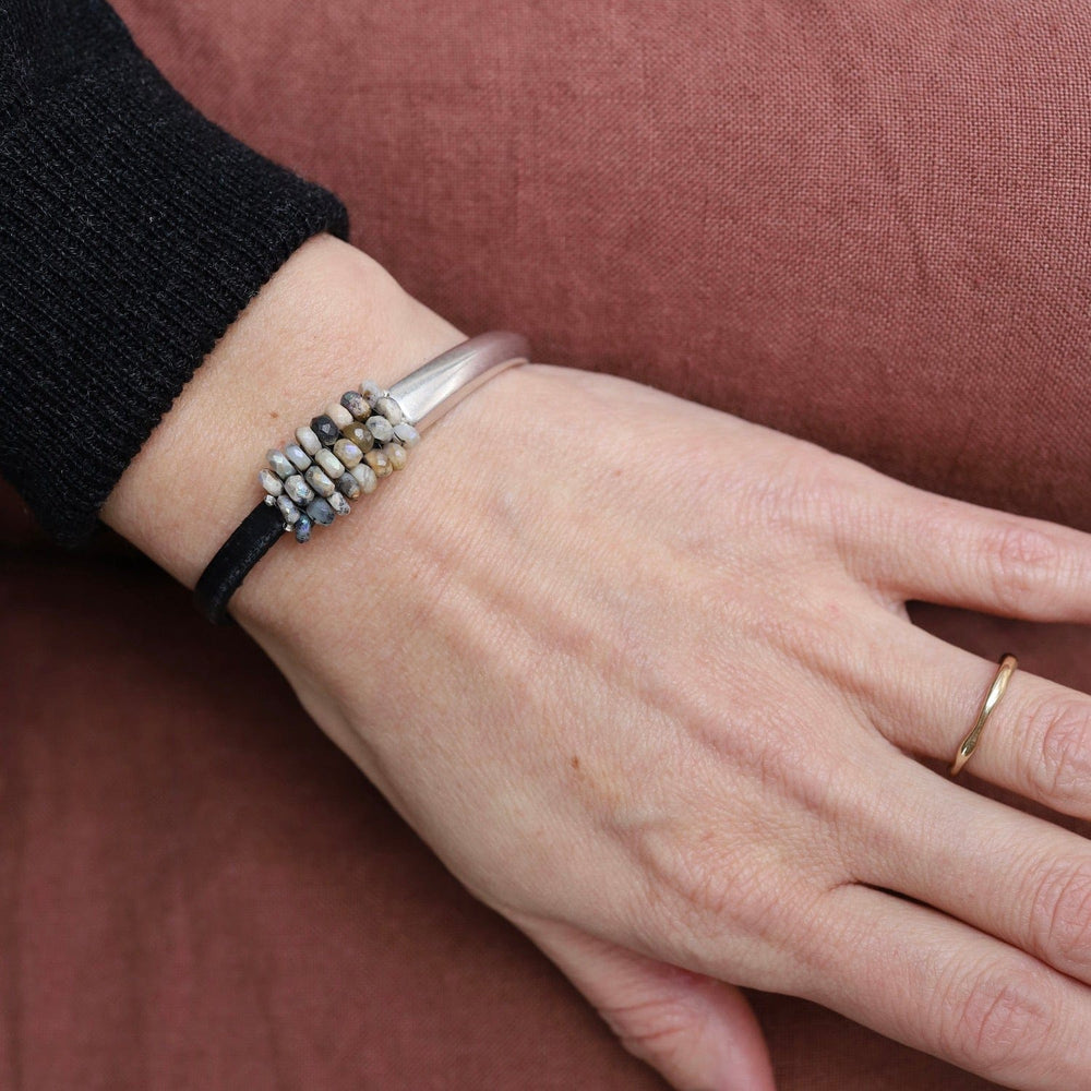 
                  
                    BRC-JM Hand Stitched Coated Dendrite with Sterling Silver Trim on Black Leather & Silver 1/2 Cuff
                  
                