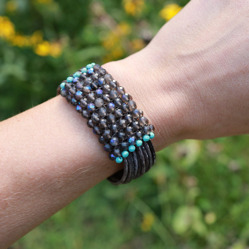 
                  
                    BRC-JM Hand Stitched Coated Labradorite with Turquoise Trim Bracelet
                  
                