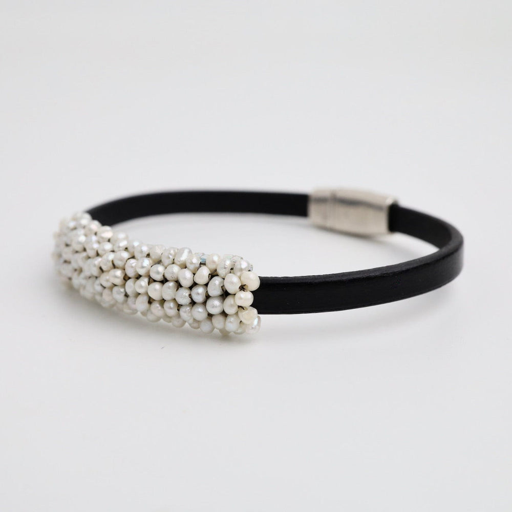 
                  
                    BRC-JM Hand Stitched Fresh Water Pearls On Black Flat Leather Bracelet
                  
                