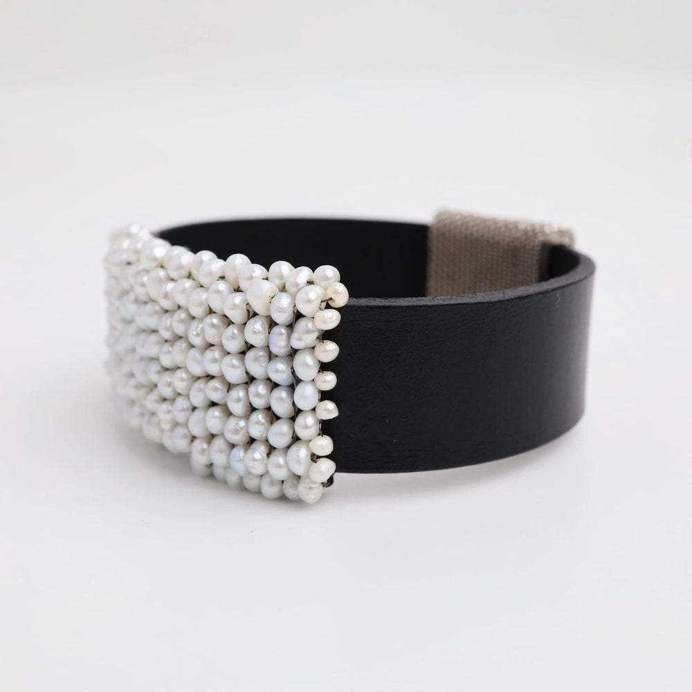 
                  
                    BRC-JM Hand Stitched Fresh Water Pearls On Black Leather Bracelet
                  
                