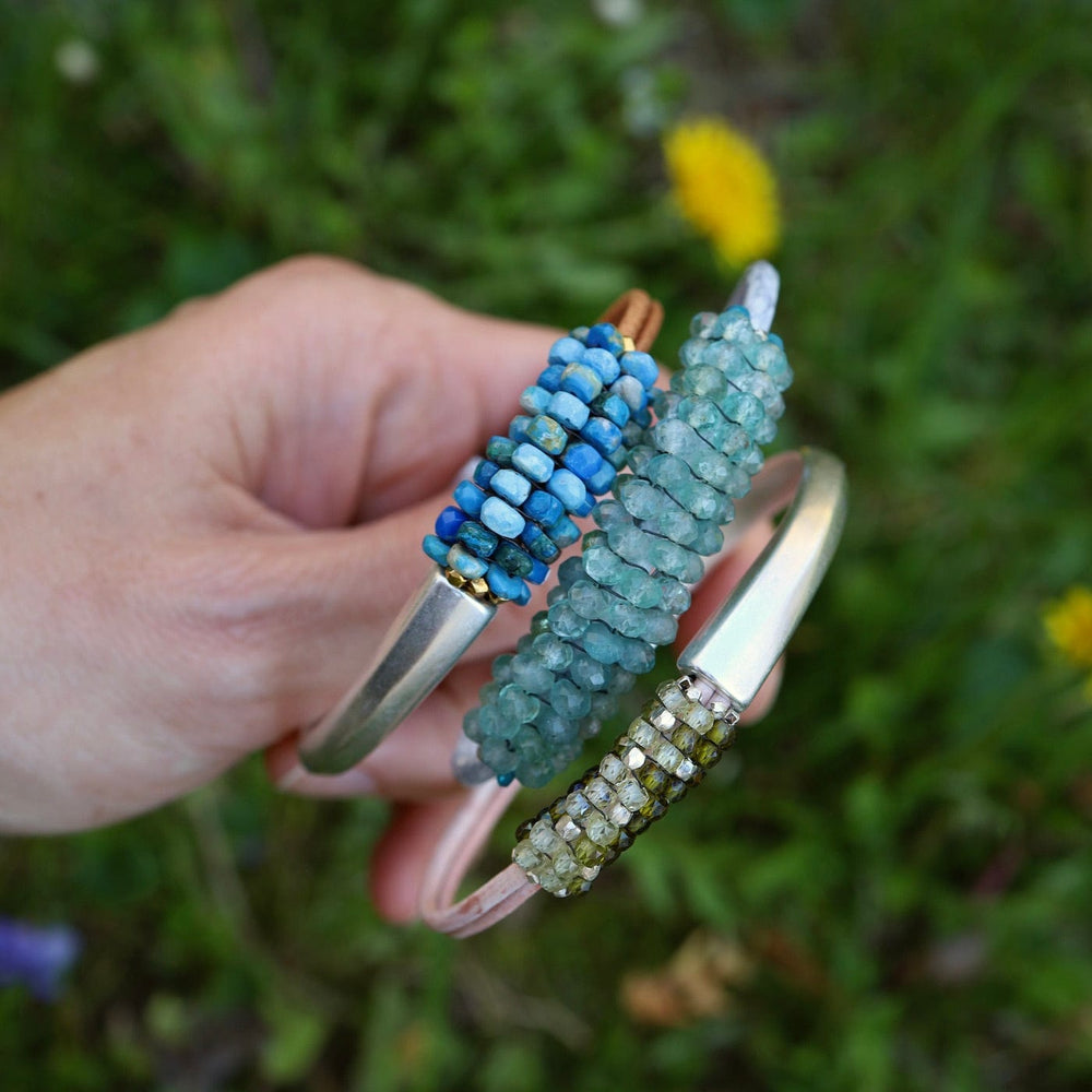 
                  
                    BRC-JM Hand Stitched Green Zircon & Sterling Silver Mix 1/2 Cuff Bracelet
                  
                