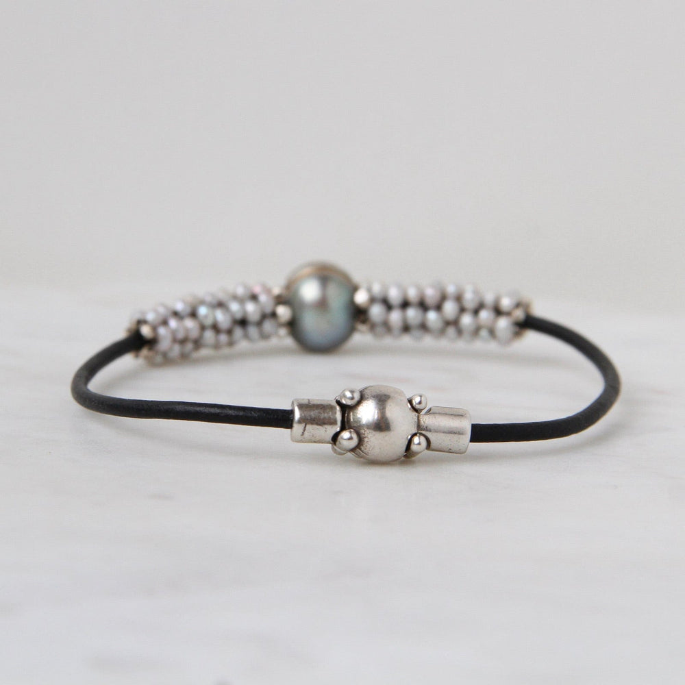 
                  
                    BRC-JM Hand Stitched Large Grey Pearl & Tiny Pearl Bracelet
                  
                