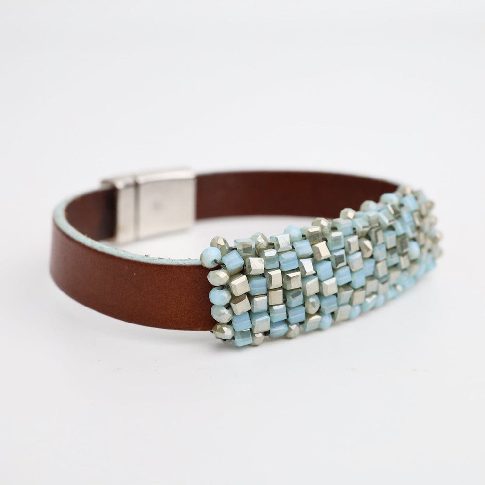 
                  
                    BRC-JM Hand Stitched Light Turquoise Cube Crystals on Leather Bracelet
                  
                