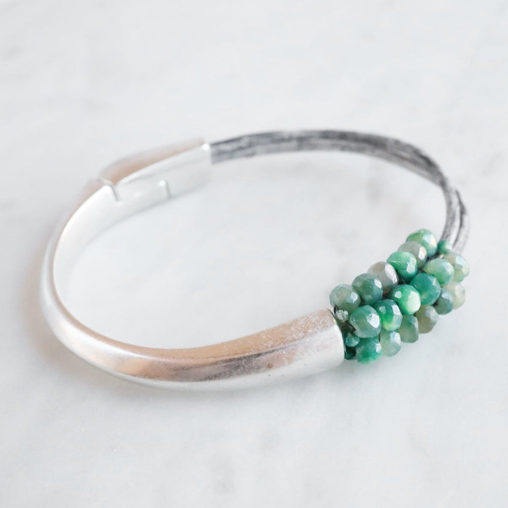 
                  
                    BRC-JM Hand Stitched Medium Coated Green Moonstone Bracelet
                  
                