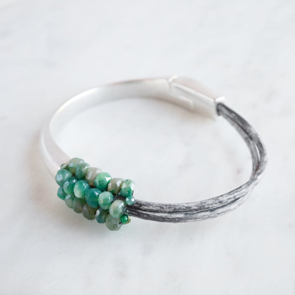 
                  
                    BRC-JM Hand Stitched Medium Coated Green Moonstone Bracelet
                  
                