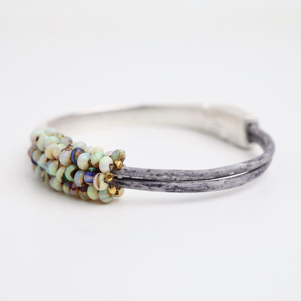 
                  
                    BRC-JM Hand Stitched Mexican Opal Half Cuff Bracelet
                  
                