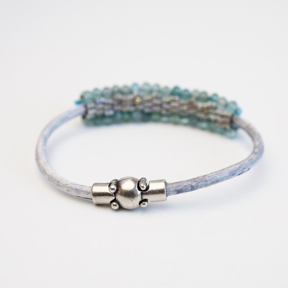 
                  
                    BRC-JM Hand Stitched Neon Apatite with Silver Trim Bracelet
                  
                