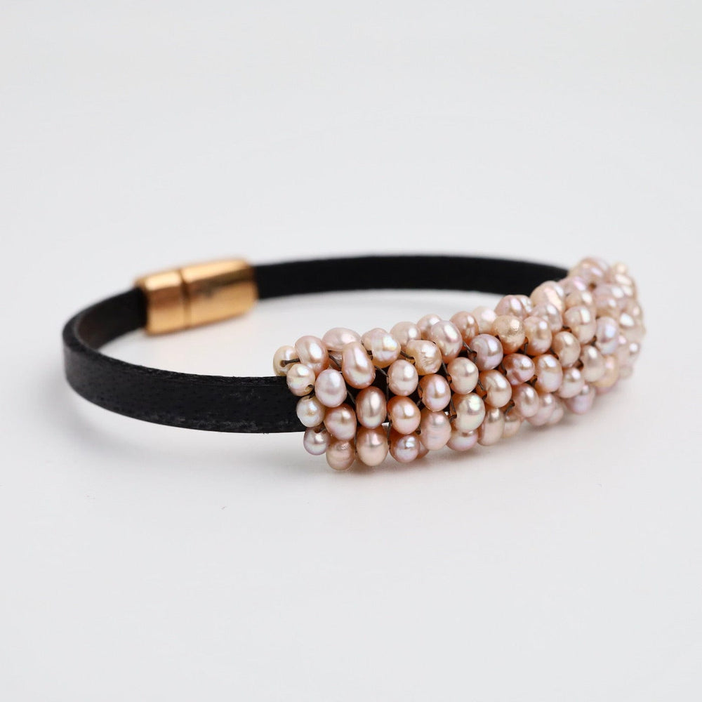 
                  
                    BRC-JM Hand Stitched Pink Pearls on 5mm Vintage Black Leather Bracelet
                  
                