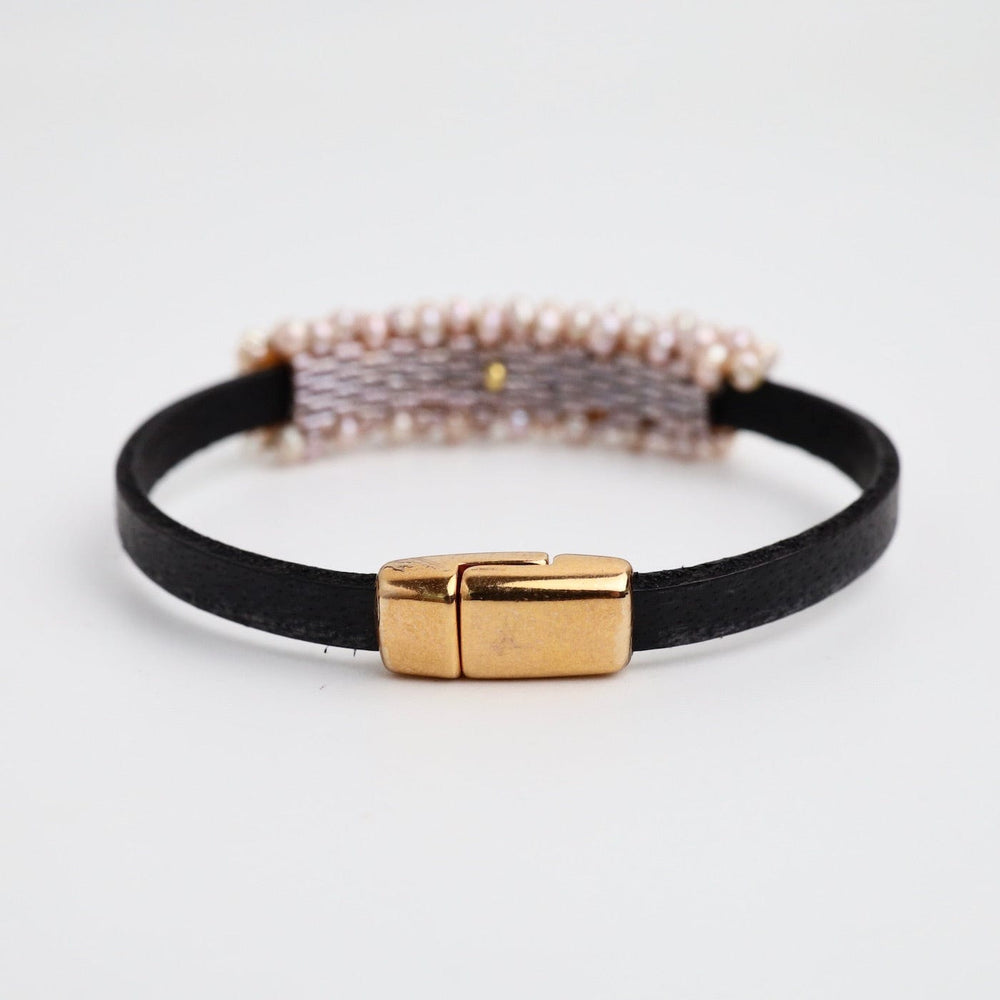 
                  
                    BRC-JM Hand Stitched Pink Pearls on 5mm Vintage Black Leather Bracelet
                  
                