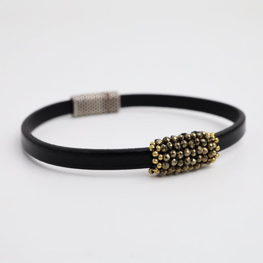 
                  
                    BRC-JM Hand Stitched Pyrite Leather Bracelet
                  
                