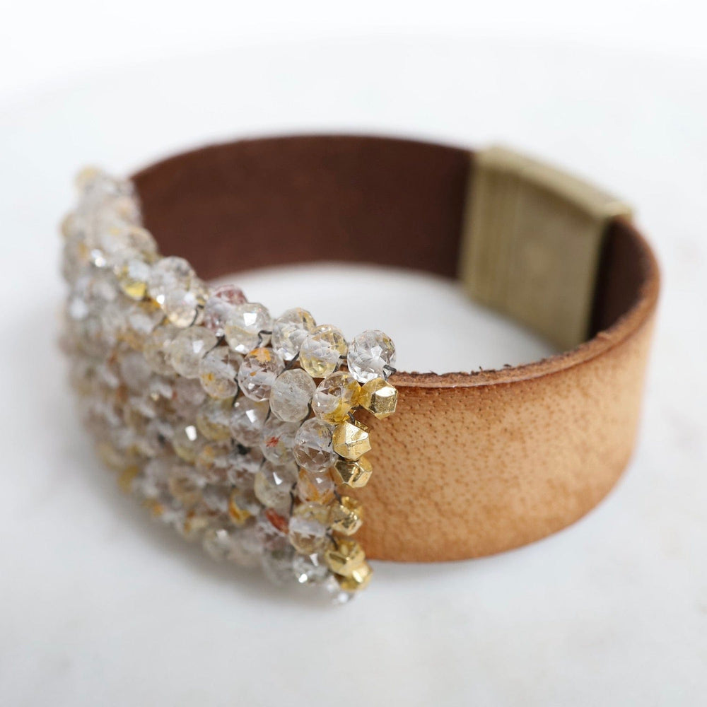 
                  
                    BRC-JM Hand Stitched Rutilated Quartz with Large Vermeil Trim on Mocha Leather Bracelet
                  
                