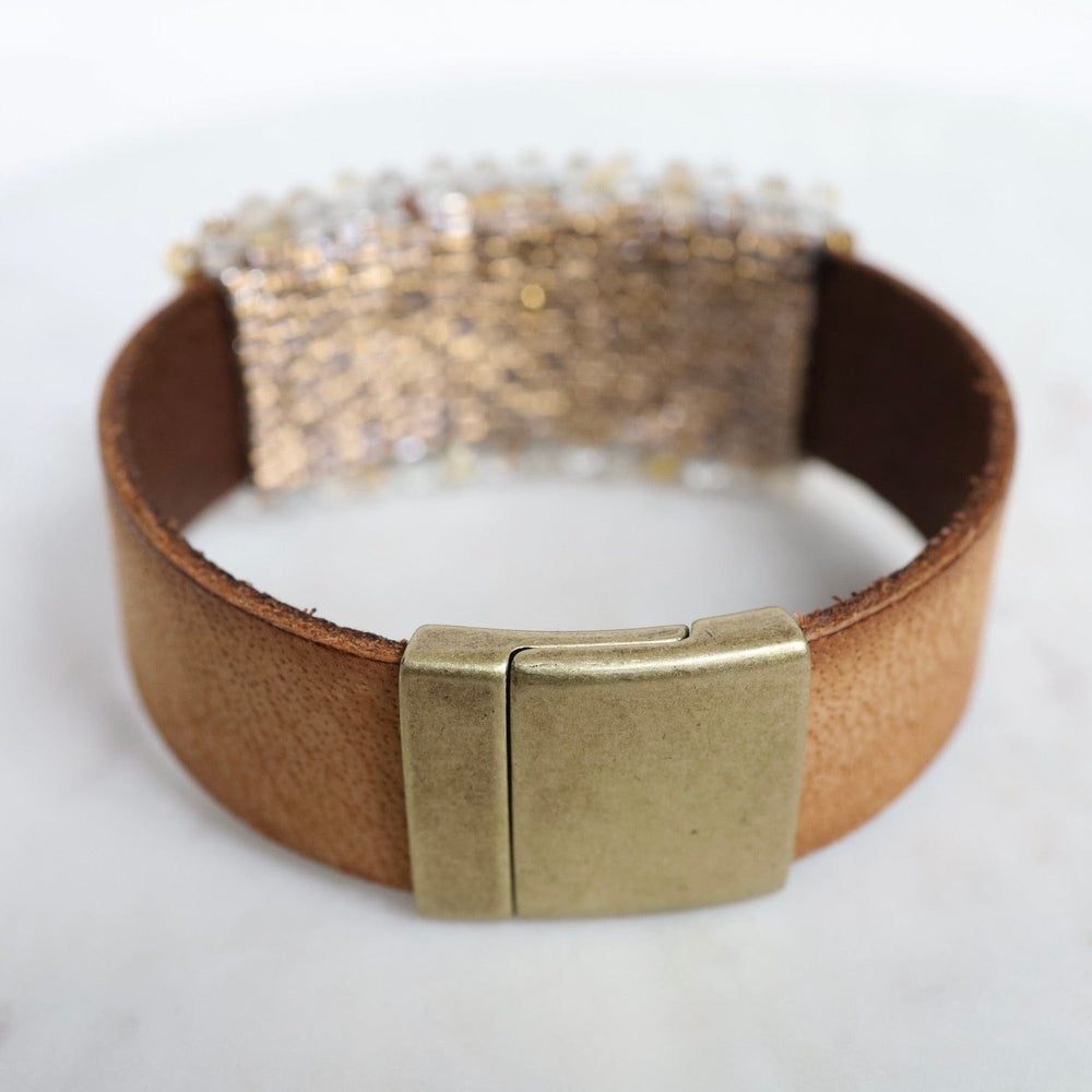 
                  
                    BRC-JM Hand Stitched Rutilated Quartz with Large Vermeil Trim on Mocha Leather Bracelet
                  
                