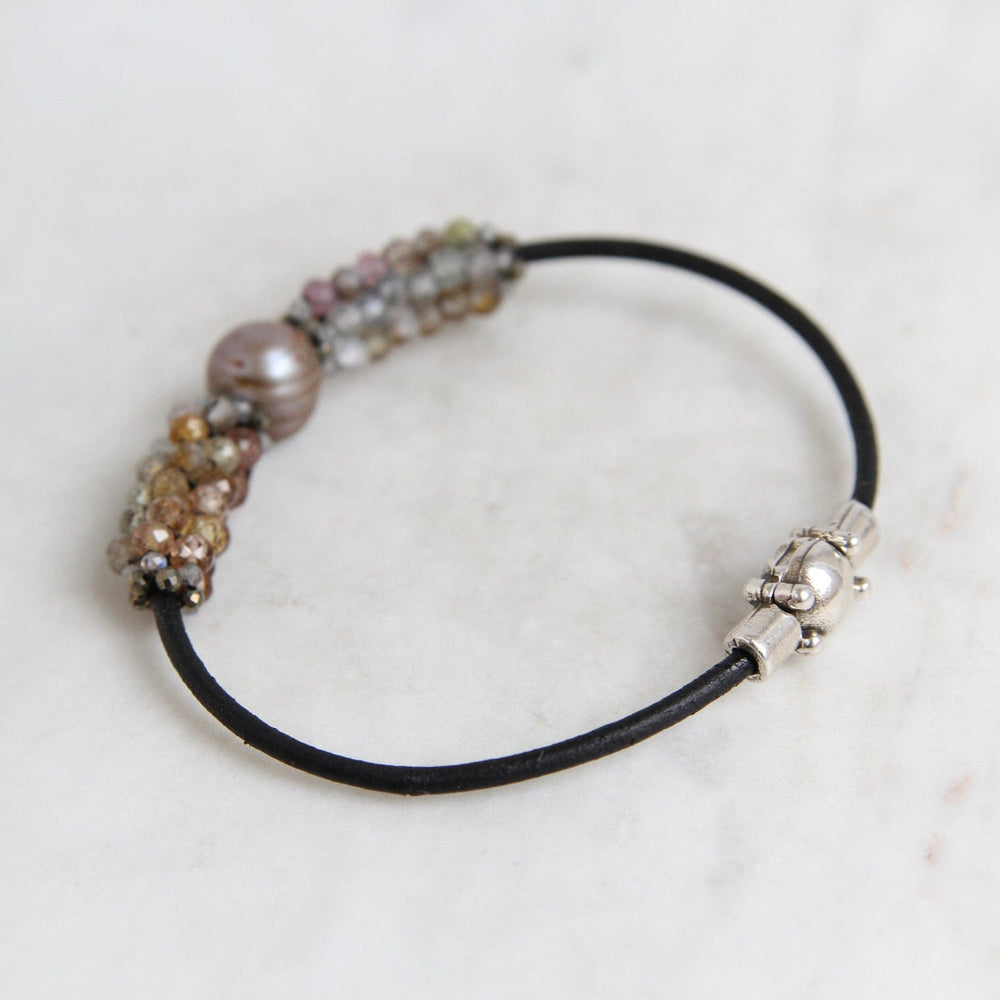 
                  
                    BRC-JM Hand Stitched Sapphires with Focal Pearl, Tiny Pyrite & Mystic Labradorite Trim Bracelet
                  
                