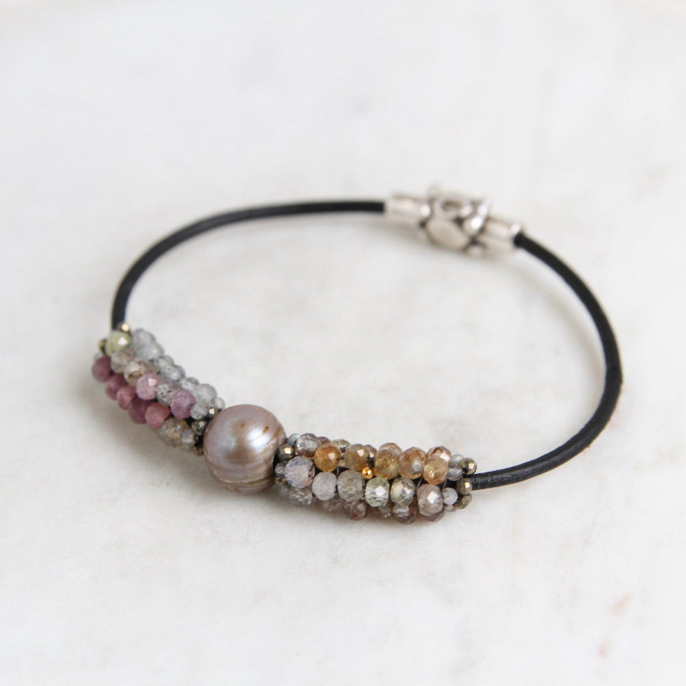 
                  
                    BRC-JM Hand Stitched Sapphires with Focal Pearl, Tiny Pyrite & Mystic Labradorite Trim Bracelet
                  
                