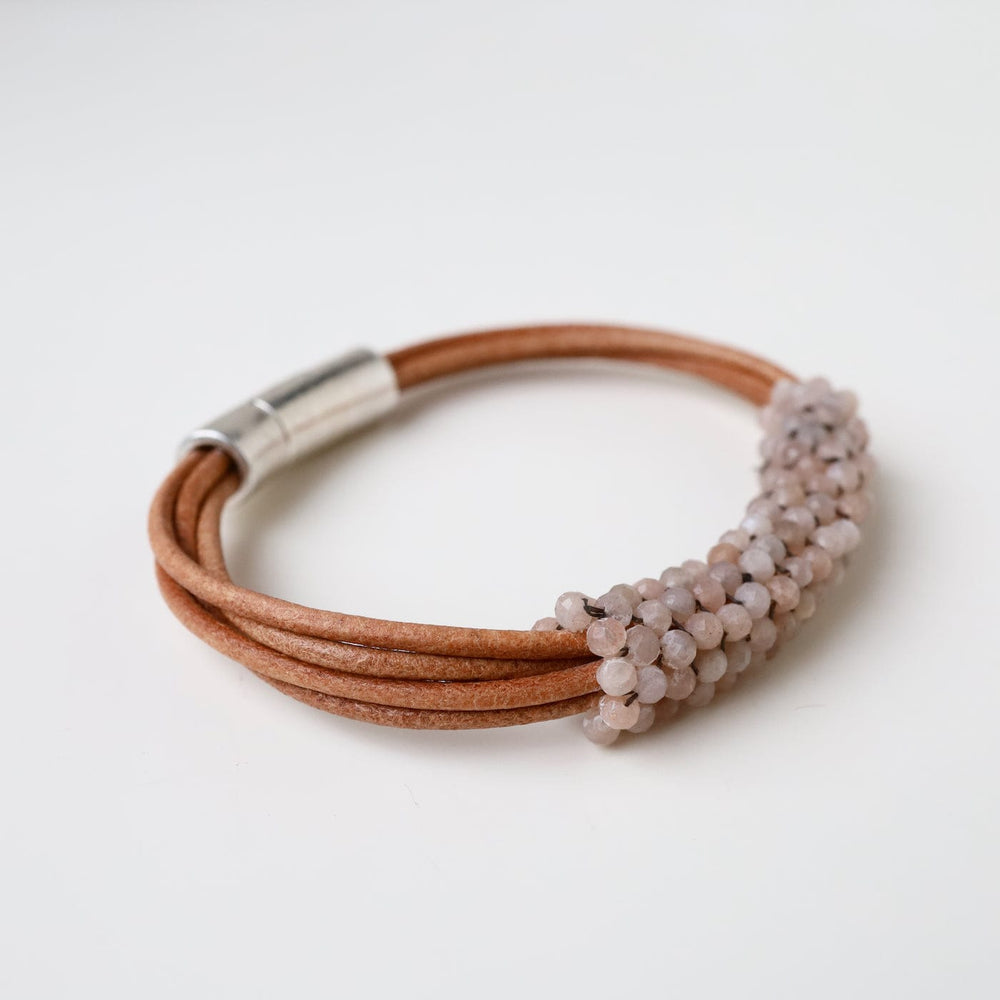 
                  
                    BRC-JM Hand Stitched Shaded Peach Moonstone Multi-Strand Bracelet
                  
                