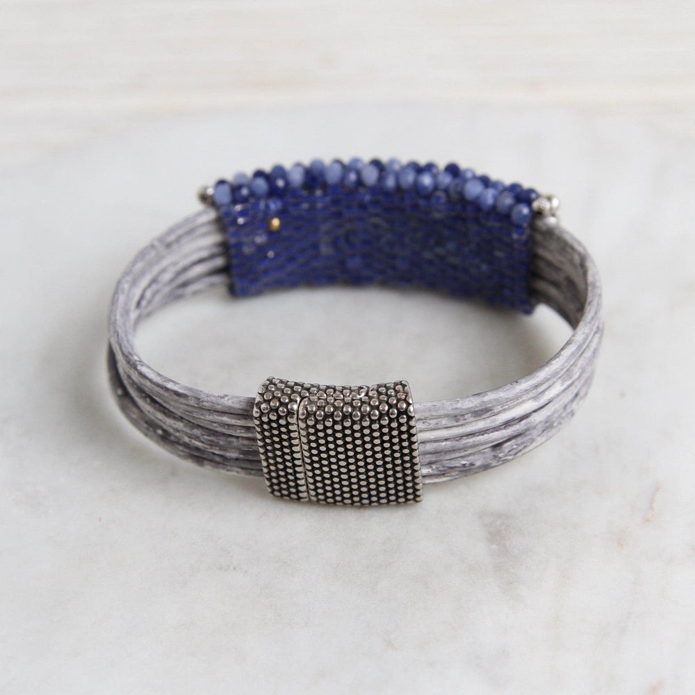 
                  
                    BRC-JM Hand Stitched Shaded Sodalite with Hill Tribe Stamped Fine Silver Bead Trim Bracelet
                  
                