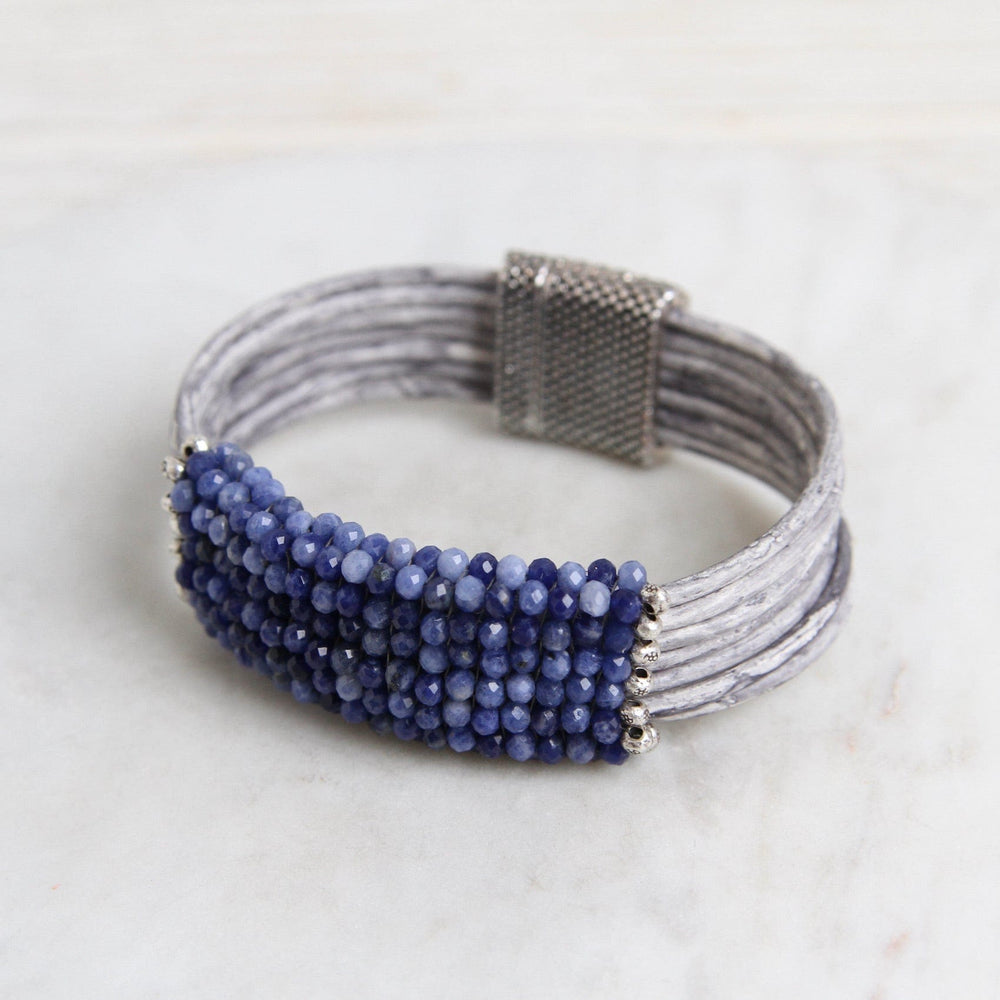 
                  
                    BRC-JM Hand Stitched Shaded Sodalite with Hill Tribe Stamped Fine Silver Bead Trim Bracelet
                  
                