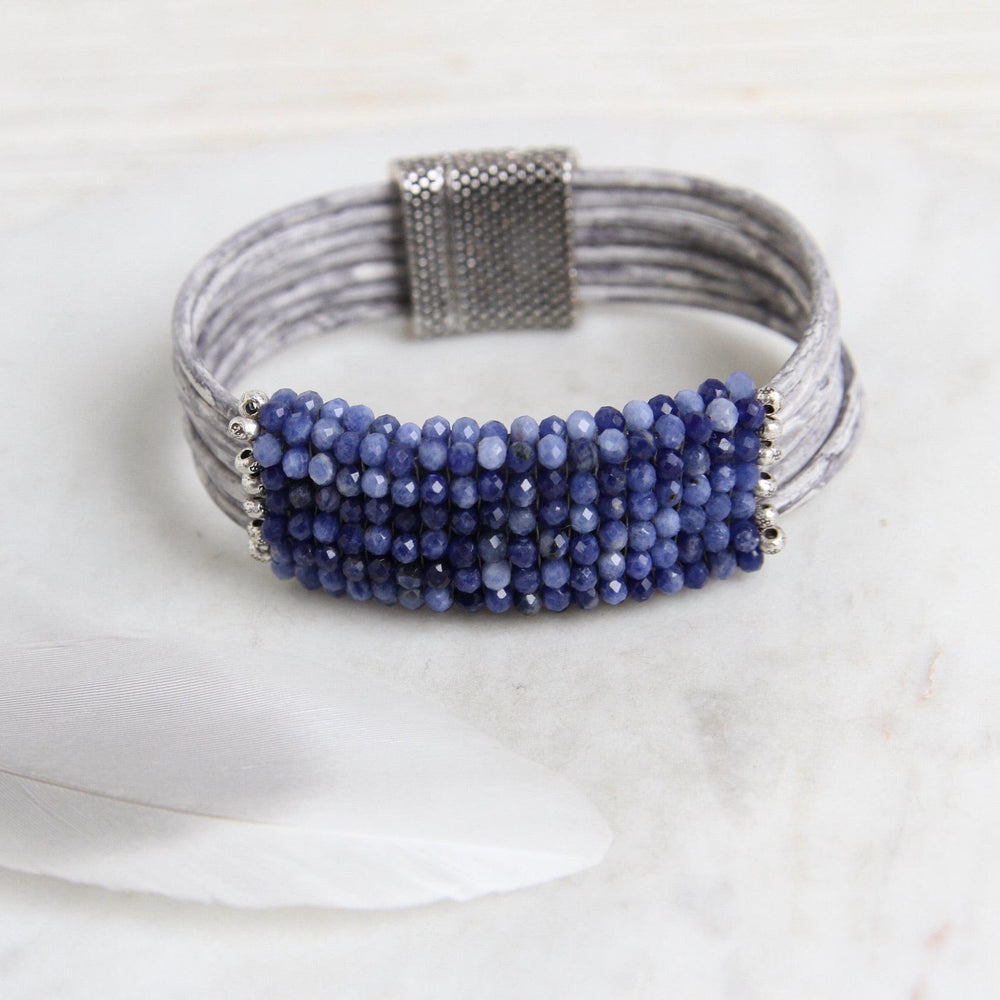 
                  
                    BRC-JM Hand Stitched Shaded Sodalite with Hill Tribe Stamped Fine Silver Bead Trim Bracelet
                  
                