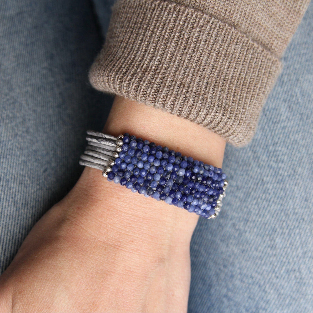 
                  
                    BRC-JM Hand Stitched Shaded Sodalite with Hill Tribe Stamped Fine Silver Bead Trim Bracelet
                  
                