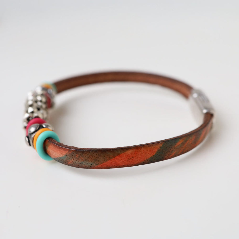 
                  
                    BRC-JM Hand Stitched Silver Cube Beads with Colored "O" Ring Bracelet
                  
                