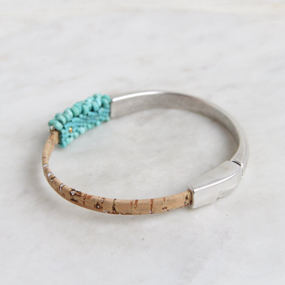 
                  
                    BRC-JM Hand Stitched Sleeping Beauty Turquoise & Cork 1/2 Cuff Bracelet
                  
                