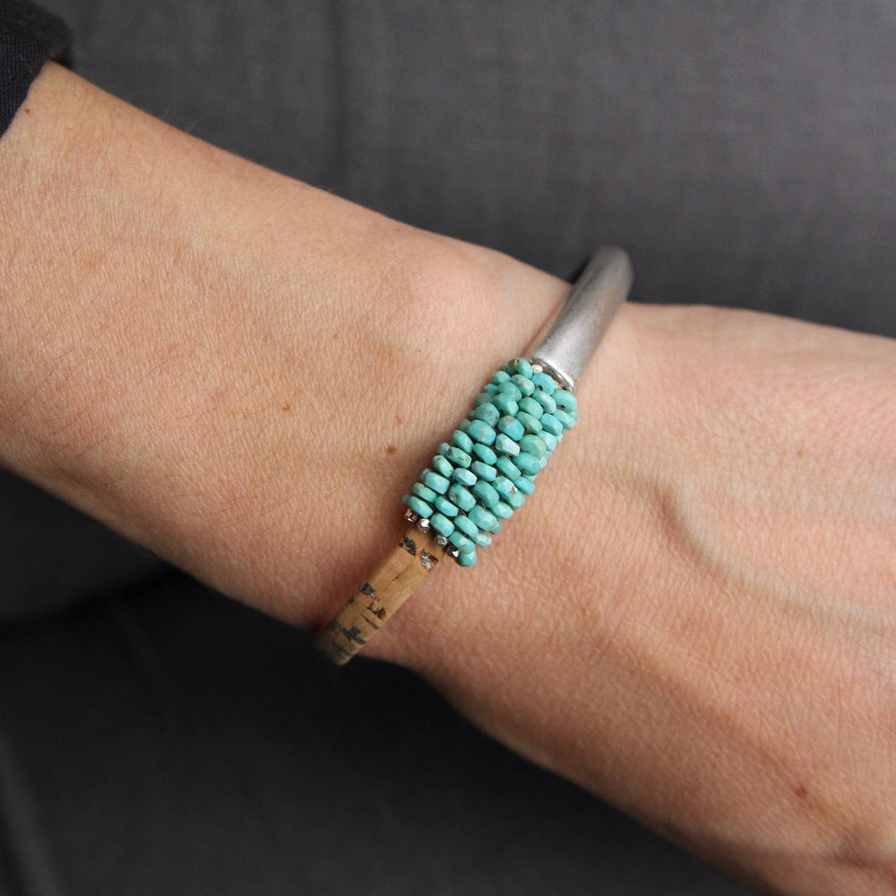 
                  
                    BRC-JM Hand Stitched Sleeping Beauty Turquoise & Cork 1/2 Cuff Bracelet
                  
                