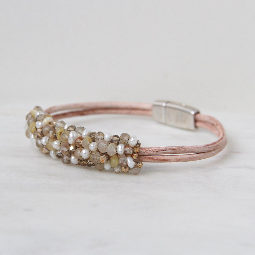 
                  
                    BRC-JM Hand Stitched Small Pearls & Rutilated Quartz Bracelet
                  
                