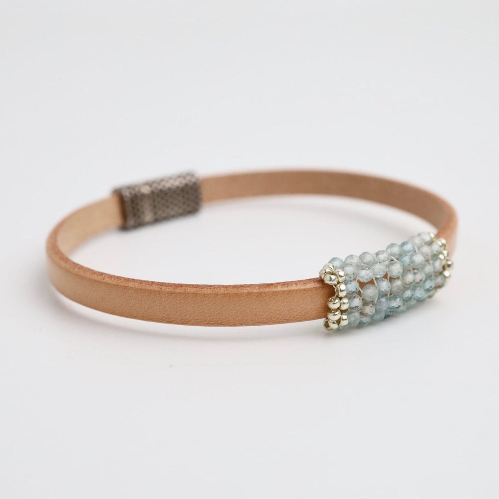 
                      
                        BRC-JM Hand Stitched Tiny Aquamarine Leather Bracelet
                      
                    