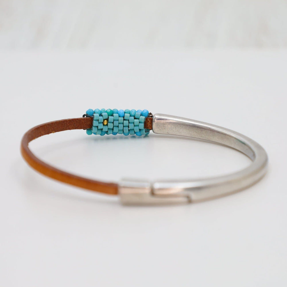 
                  
                    BRC-JM Hand Stitched Tiny Arizona Turquoise Leather Cuff Bracelet
                  
                