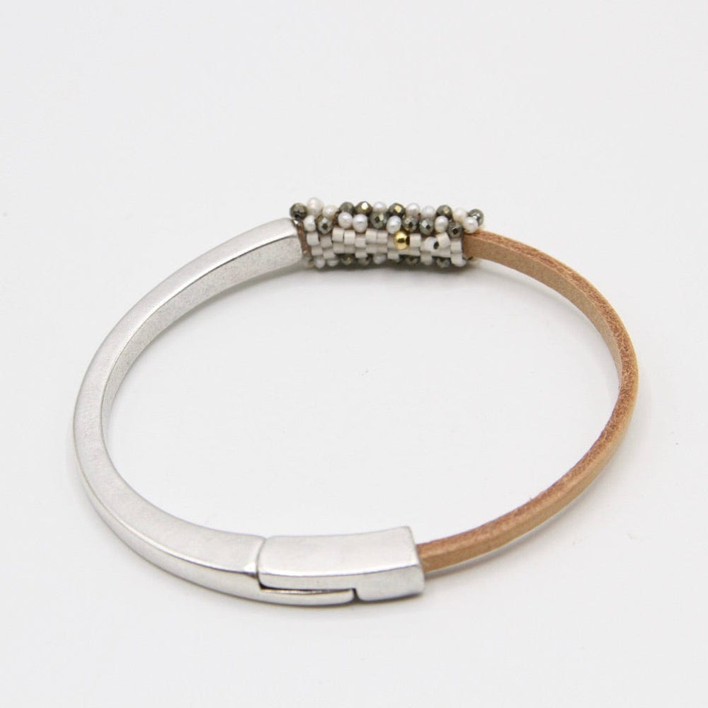 
                  
                    BRC-JM Hand Stitched Tiny White Pearls and Pyrite Leather Cuff Bracelet
                  
                