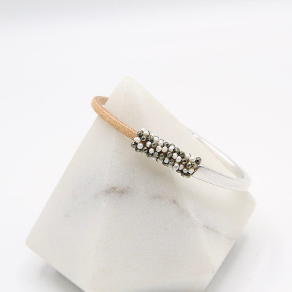 
                  
                    BRC-JM Hand Stitched Tiny White Pearls and Pyrite Leather Cuff Bracelet
                  
                