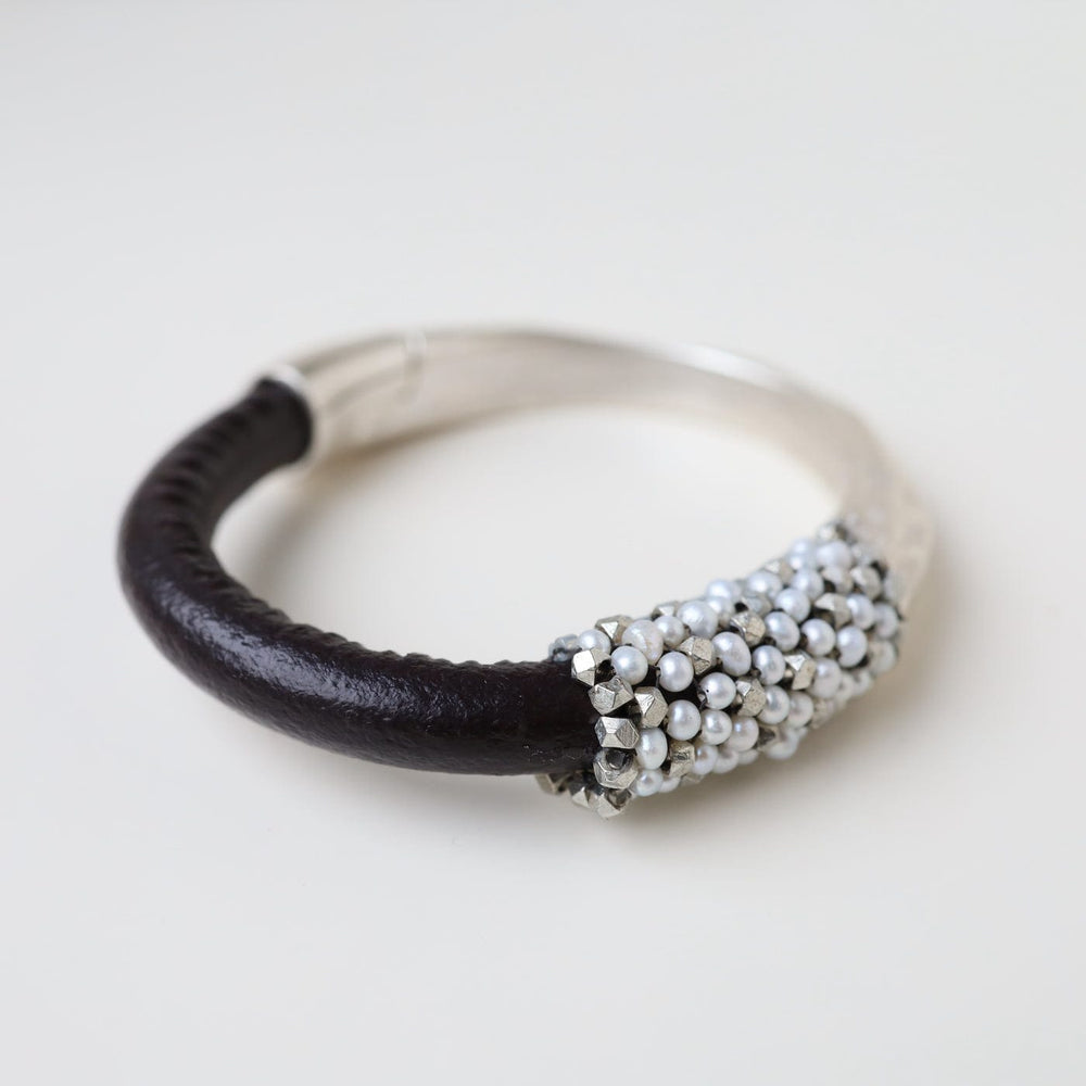 
                  
                    BRC-JM Hand Stitched White Pearls & Metal Cubes Bracelet
                  
                