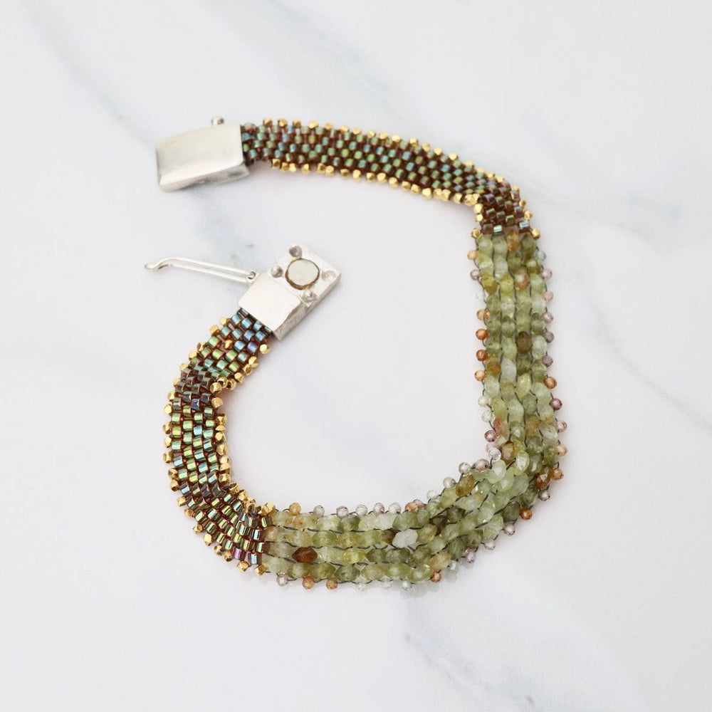 
                  
                    BRC-JM Hand Woven Soft Bracelet of Green Garnet with Tiny Grey Sapphires
                  
                