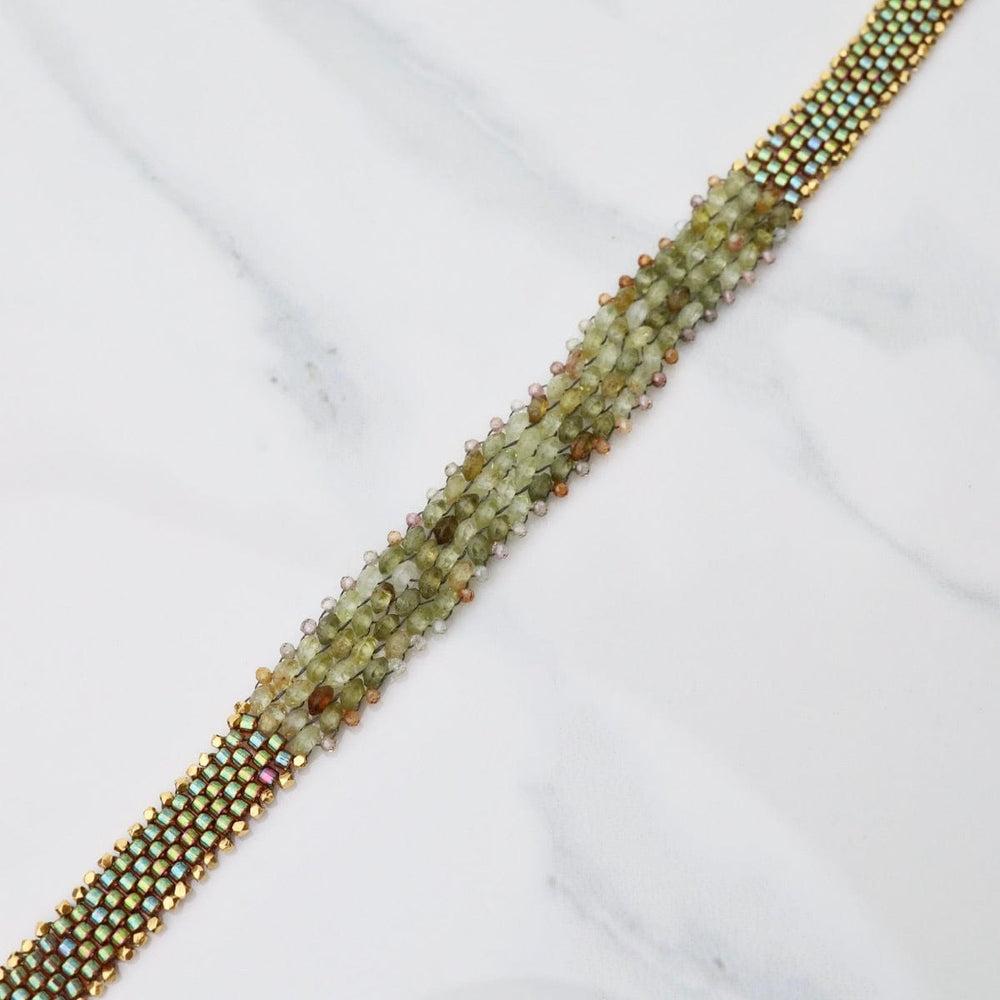 
                  
                    BRC-JM Hand Woven Soft Bracelet of Green Garnet with Tiny Grey Sapphires
                  
                