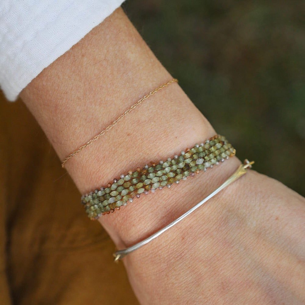 
                  
                    BRC-JM Hand Woven Soft Bracelet of Green Garnet with Tiny Grey Sapphires
                  
                