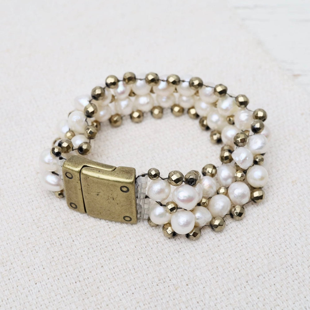 
                  
                    BRC-JM Hand Woven Soft Bracelet of White Pearls & Pyrite
                  
                