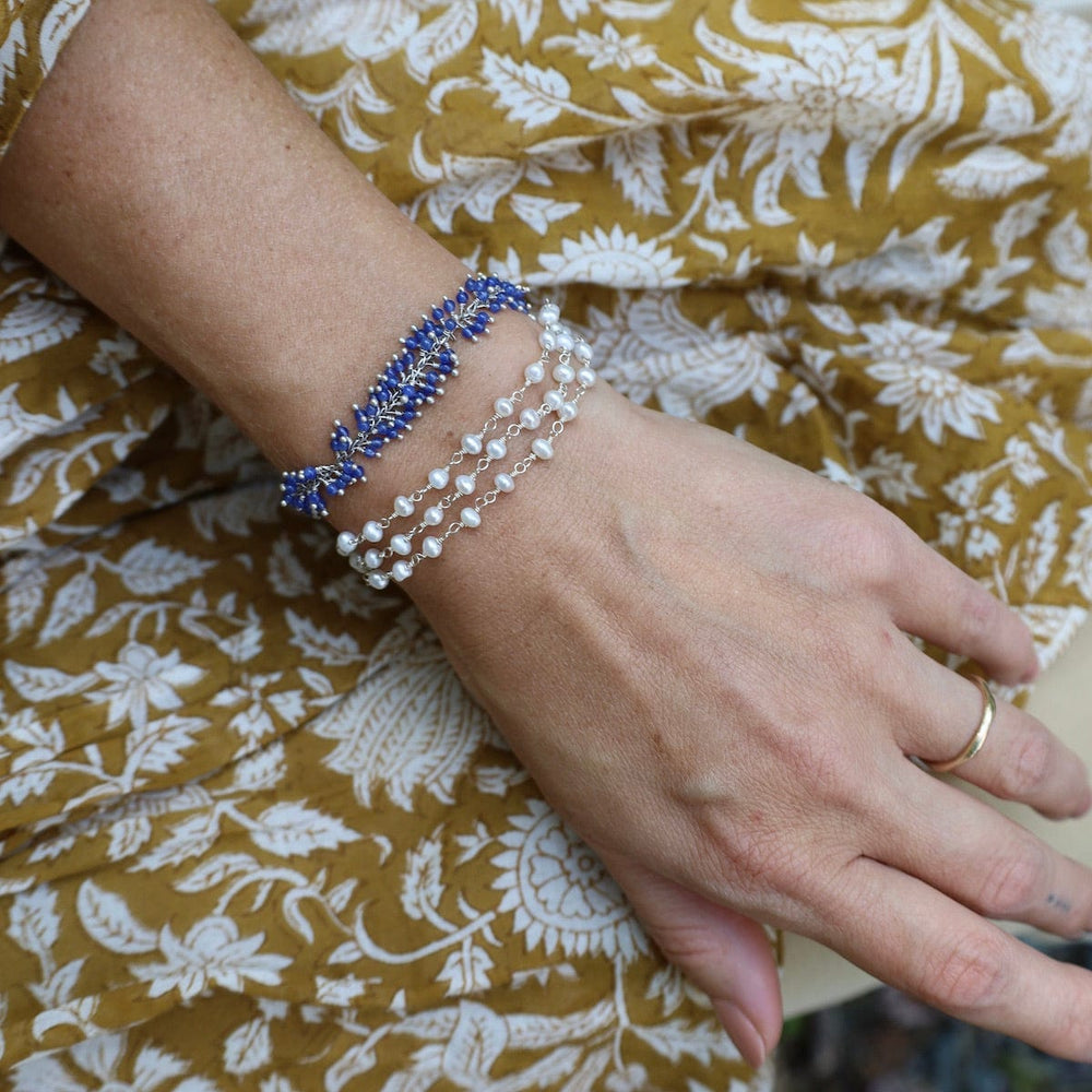 
                  
                    BRC-JM Handmade Multi Bead Chain of White Pearls Bracelet
                  
                