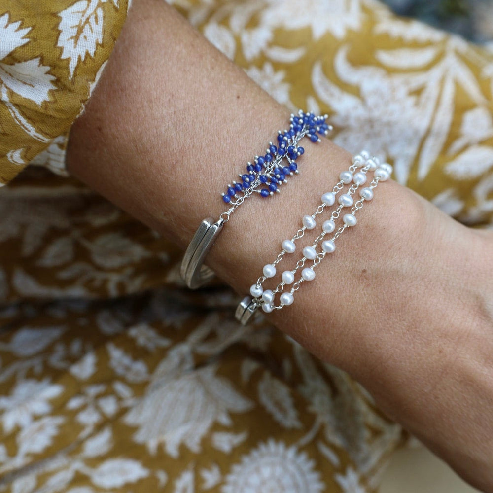 
                  
                    BRC-JM Handmade Multi Bead Chain of White Pearls Bracelet
                  
                