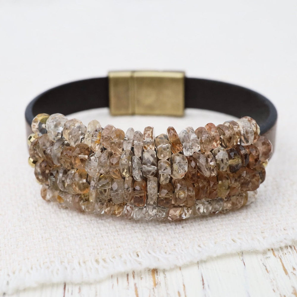 
                      
                        BRC-JM Imperial Topaz with Gold Pyrite Trim on Metallic Brown Leather Bracelet
                      
                    