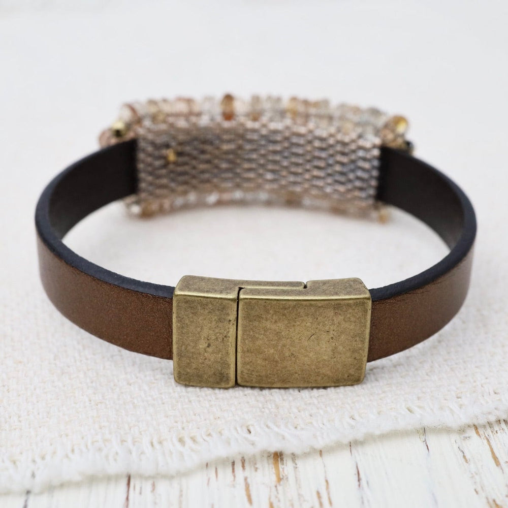 
                      
                        BRC-JM Imperial Topaz with Gold Pyrite Trim on Metallic Brown Leather Bracelet
                      
                    