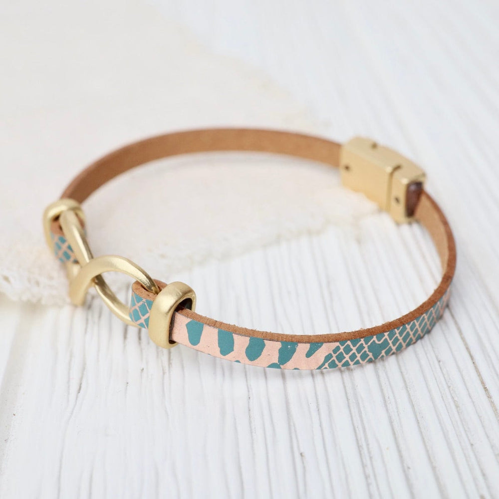 
                  
                    BRC-JM Matte Gold Metallic Turquoise Infinity Bracelet
                  
                