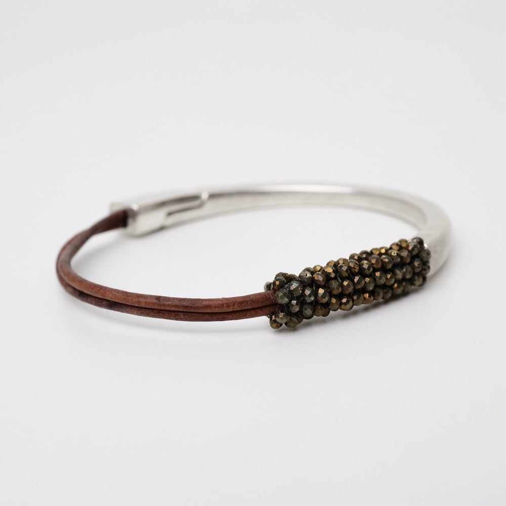 
                  
                    BRC-JM Tiny Pyrite On 2 Strands of Grey Leather Bracelet
                  
                