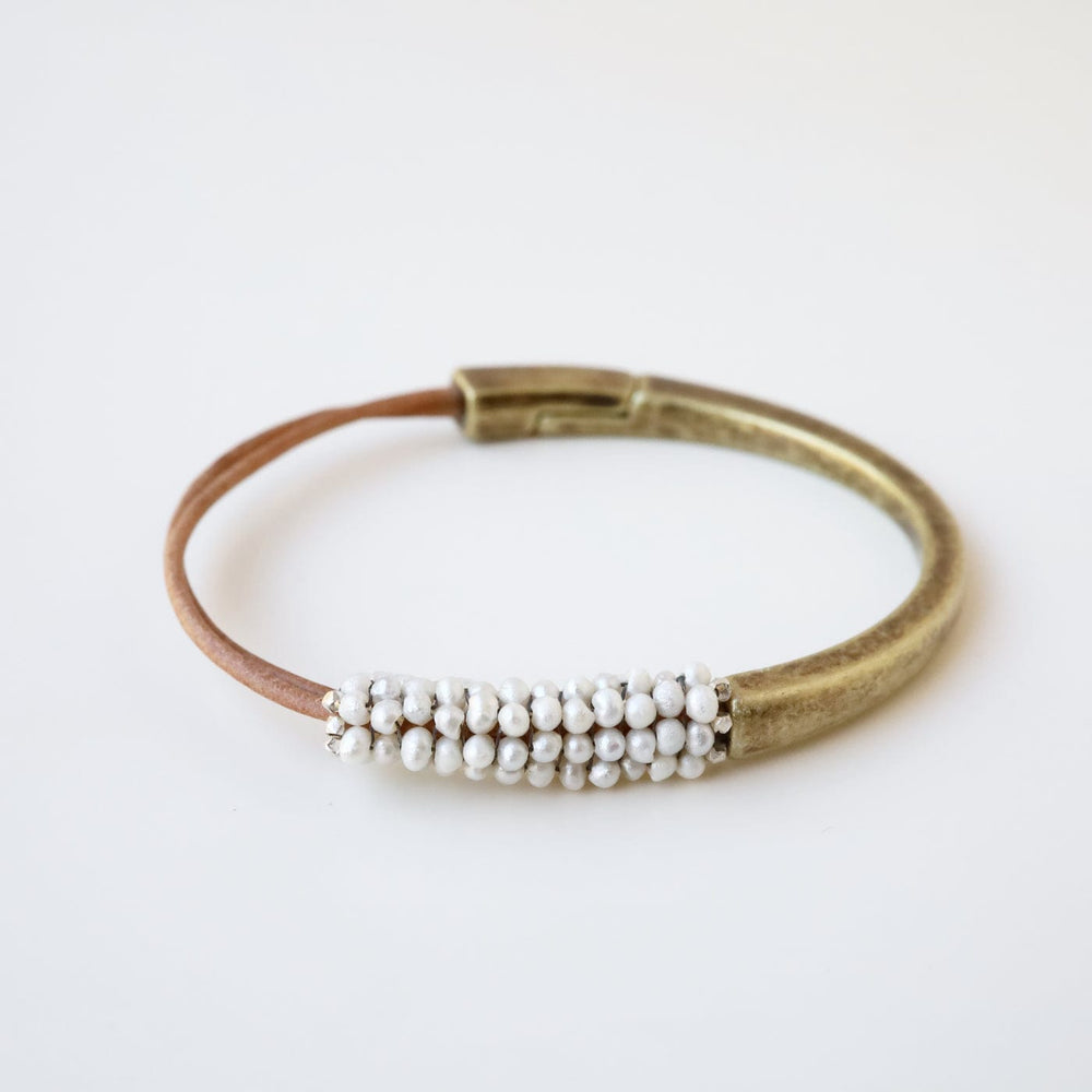 
                  
                    BRC-JM Tiny White Pearls Hand Stitched Leather and Brass 1/2 Cuff
                  
                