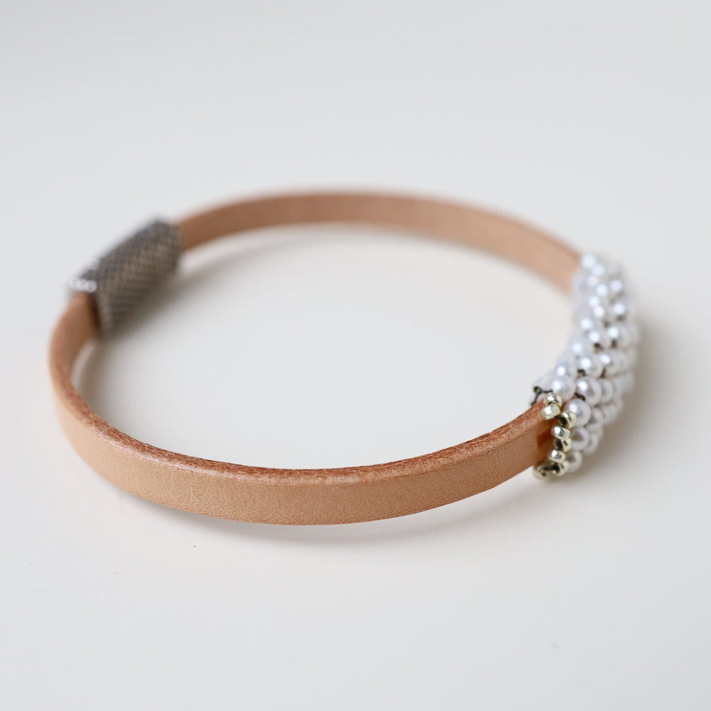 
                  
                    BRC-JM Tiny White Seed Pearls Hand Stitched Bracelet
                  
                