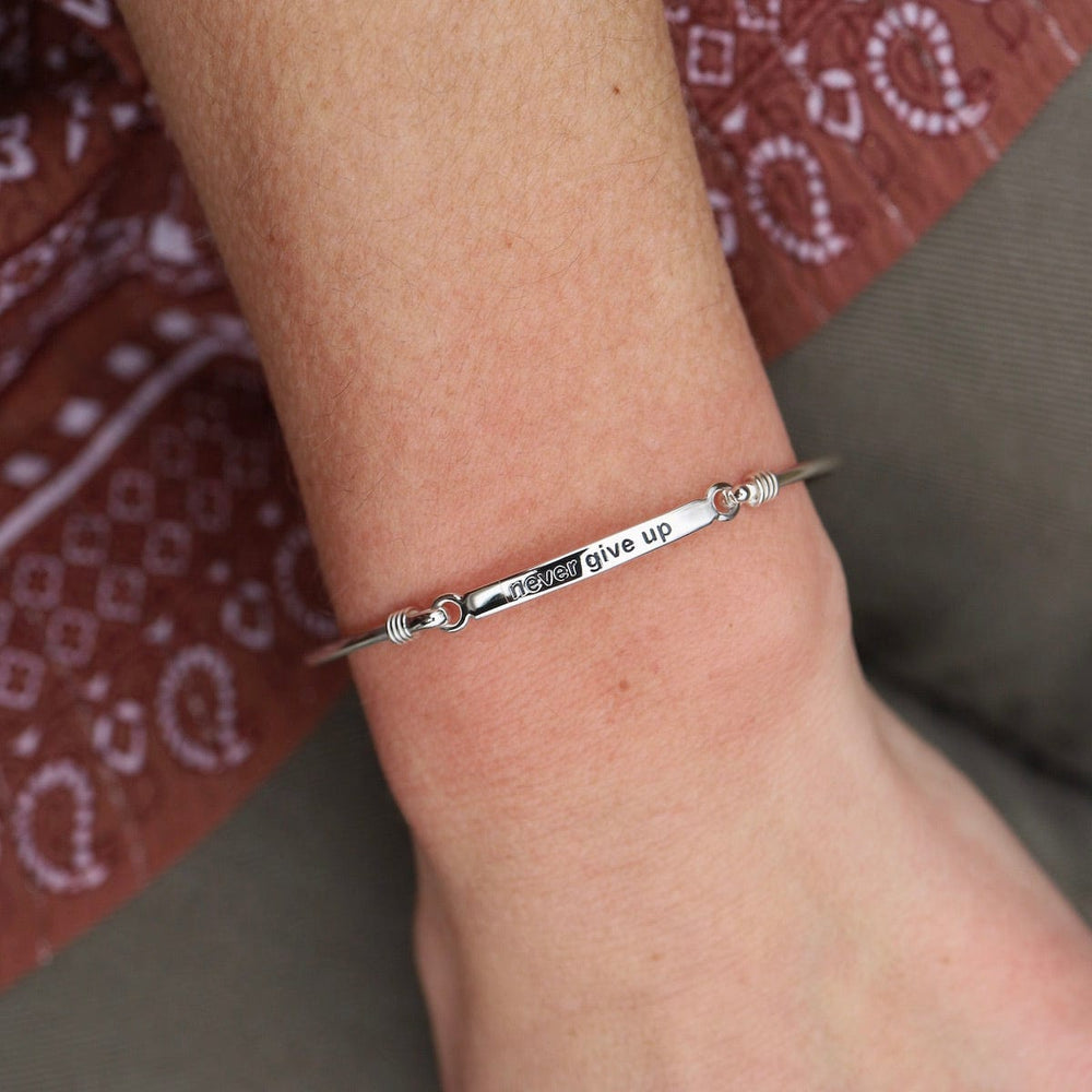 
                      
                        BRC "Never Give Up" Front Latching I.D Bangle
                      
                    