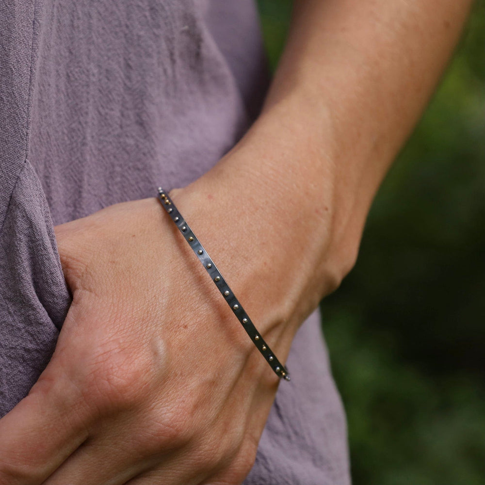 
                  
                    BRC Orbit Bangle - Oxidized Silver with Mix Metal Dots
                  
                